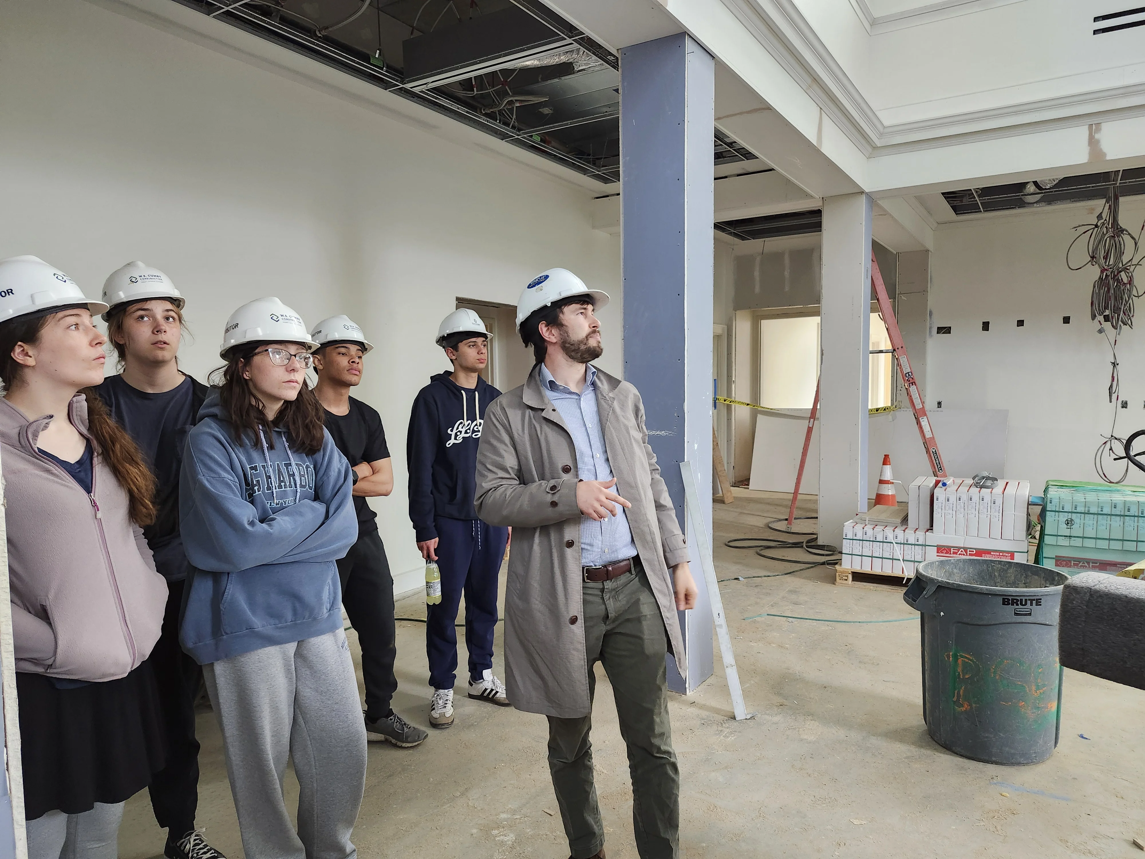 Nathaniel Gotcher leading students on an architectural site tour